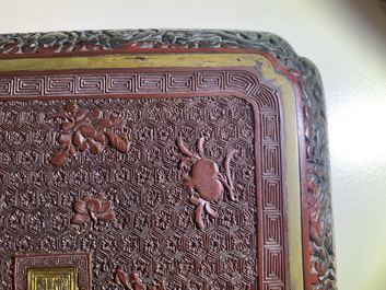 A pair of Chinese black and red cinnabar lacquer square dishes, Qianlong mark and of the period